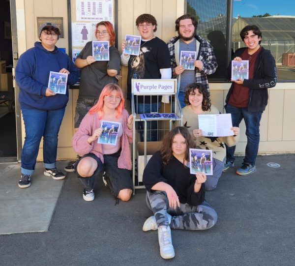 Purple Pages' 2021 Staff pose with their September Issue.