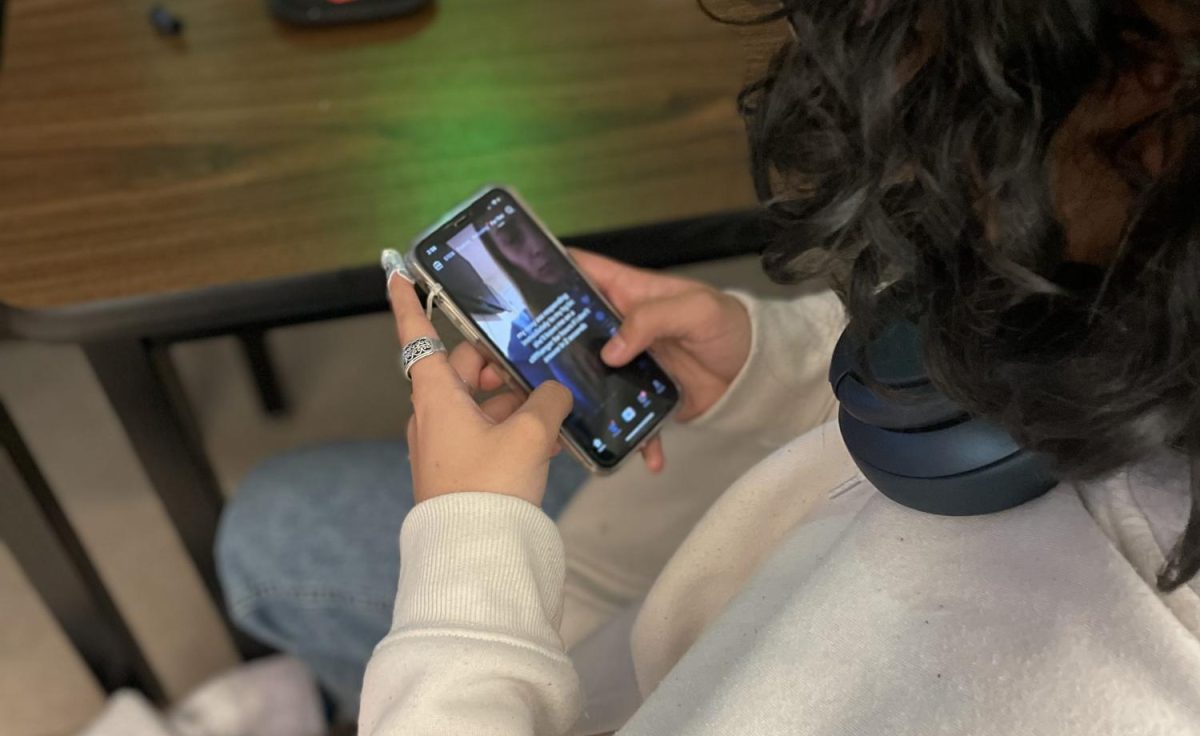 Aaliyah Afshar (12) scrolls on TikTok during study hall